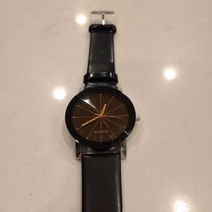 Black and gold quartz watch